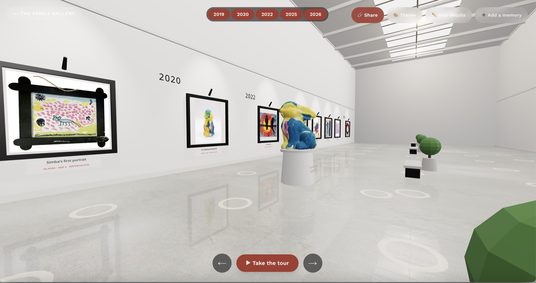 The Fridge Gallery 3D room — a child's framed paintings on white gallery walls with a colourful sculpture on a plinth